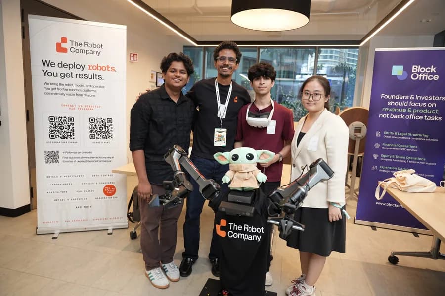 Convergence Summit attendees and robotics exhibit