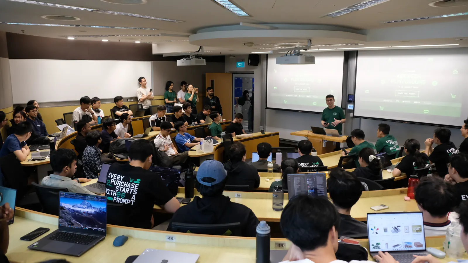 A packed lecture theatre of builders at a Convergence Summit hackathon