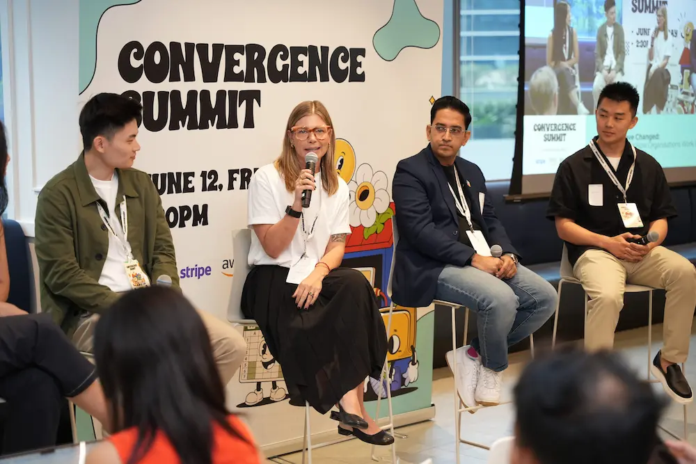 Convergence Summit panelists speaking on stage